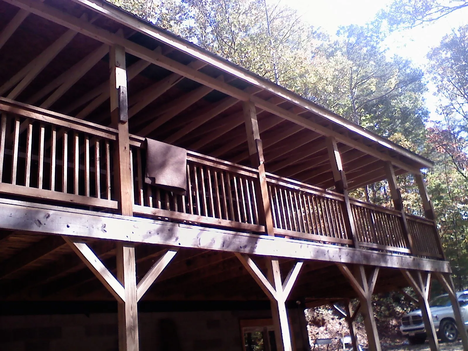 Timber framing under a new elevated porch and deck — Roof Leak Repair in Hempstead by Roofing Brothers